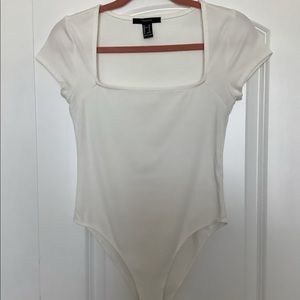 Simple, ribbed white bodysuit
